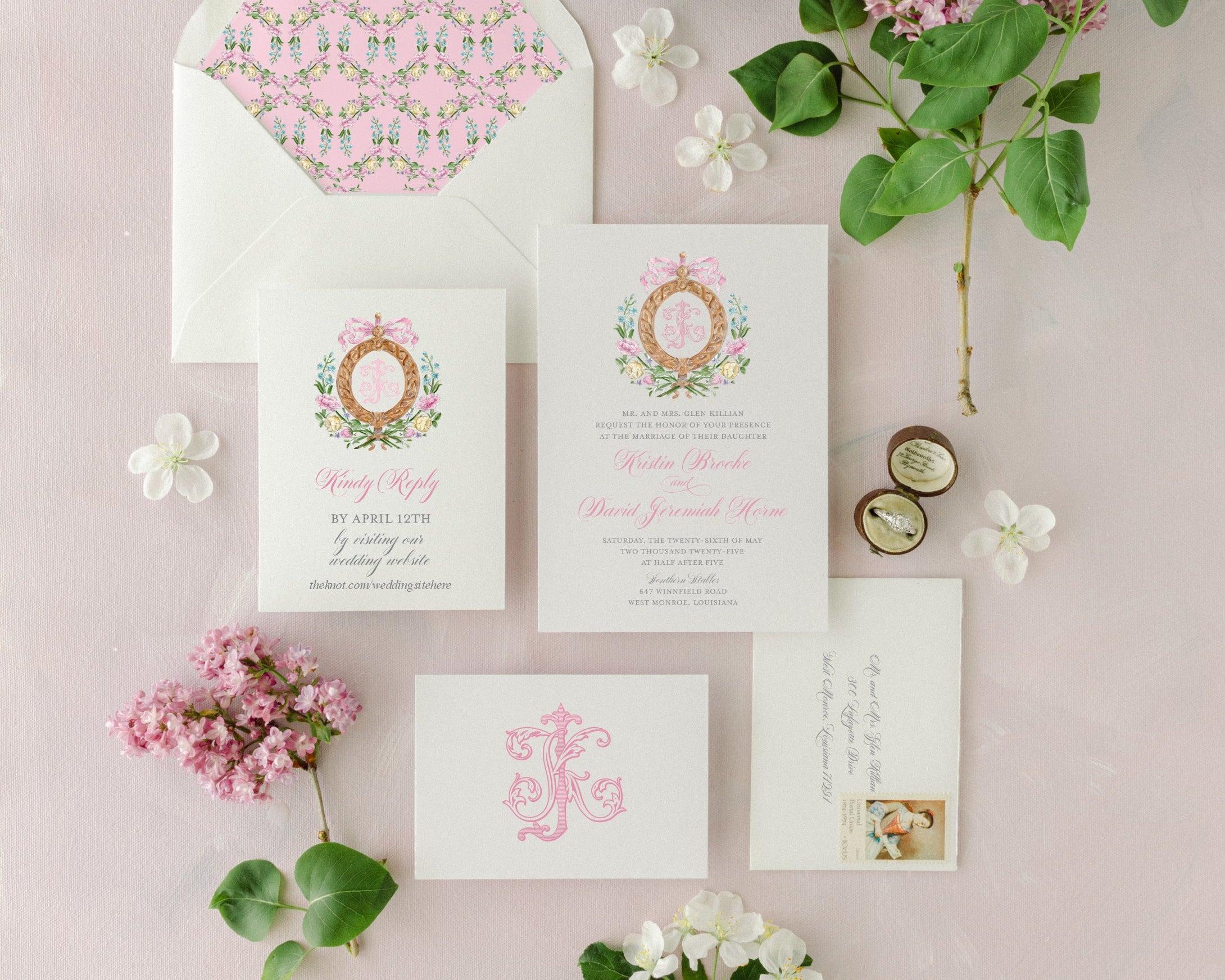 Wedding invitation set with floral design on a pink background